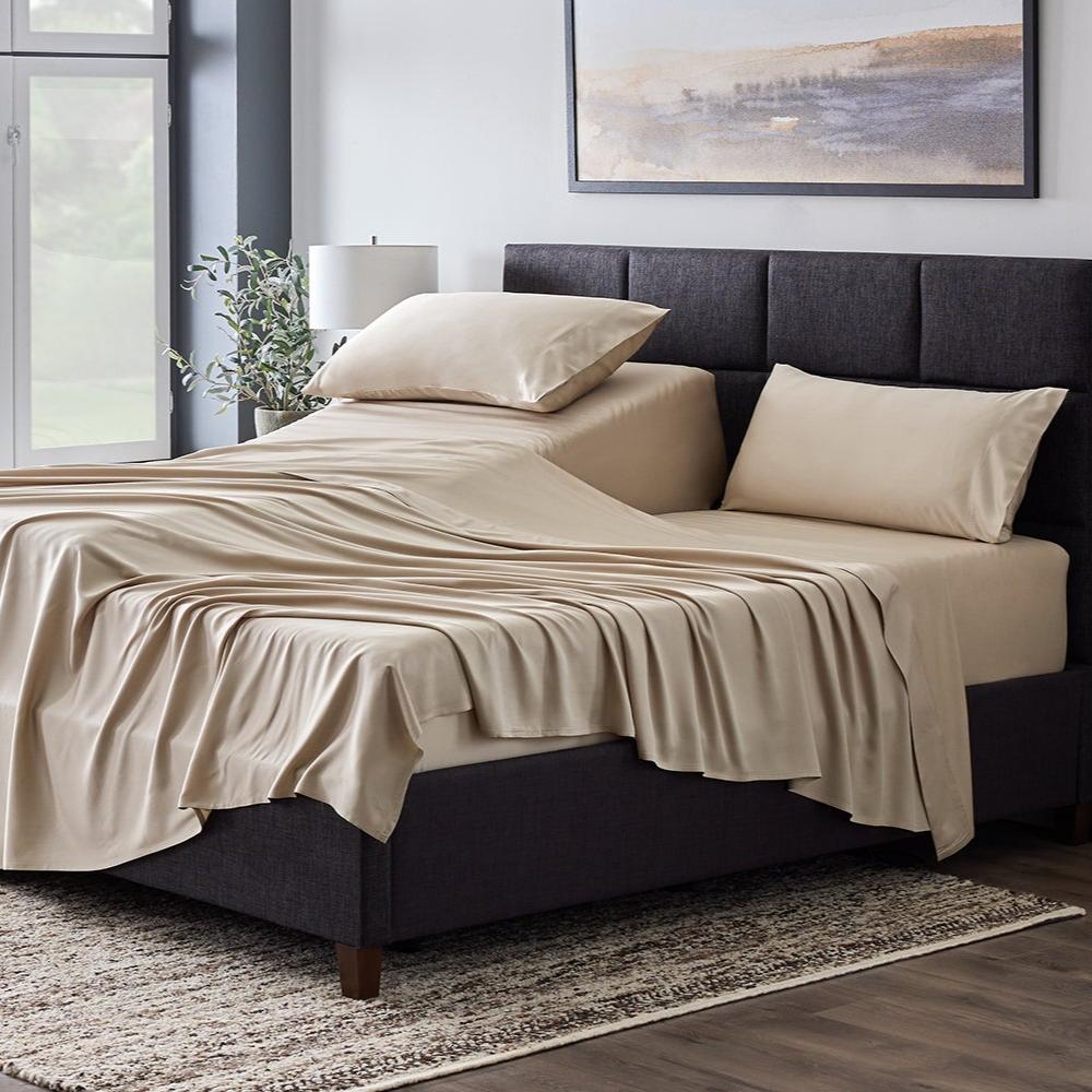 Driftwood colored sheets spread out over a bed