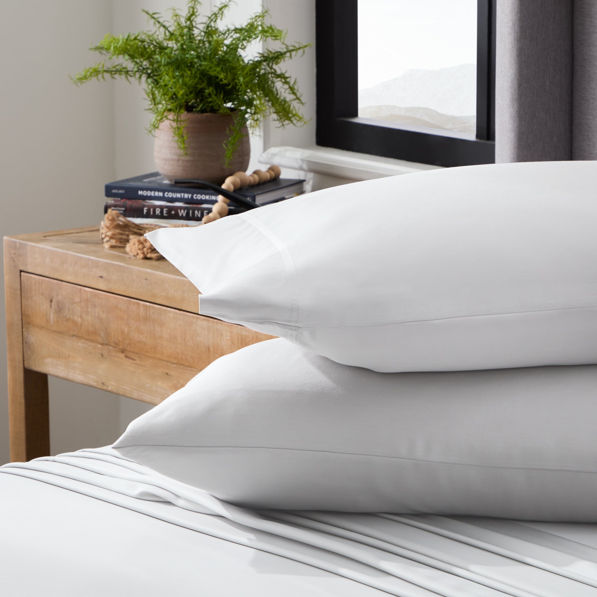 White pillows on white sheets